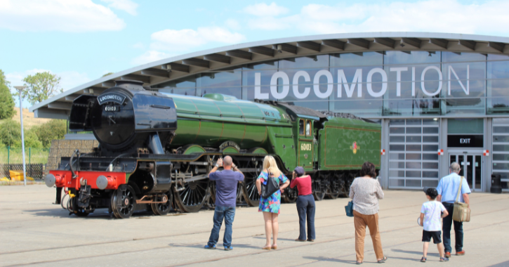 people stood looking at the flying Scotsman train at Locomotion museum